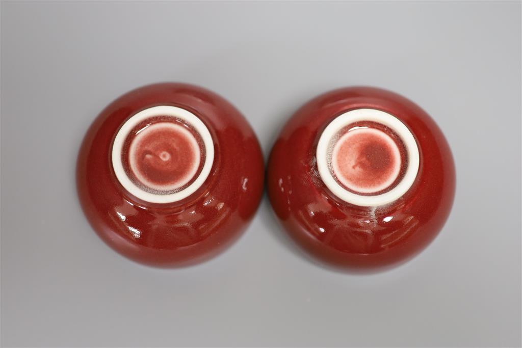 A Chinese blue and white water pot and two sang de boeuf glazed cups, tallest 9cm